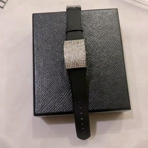 Swarovski black leather watch with crystal embellishments.
